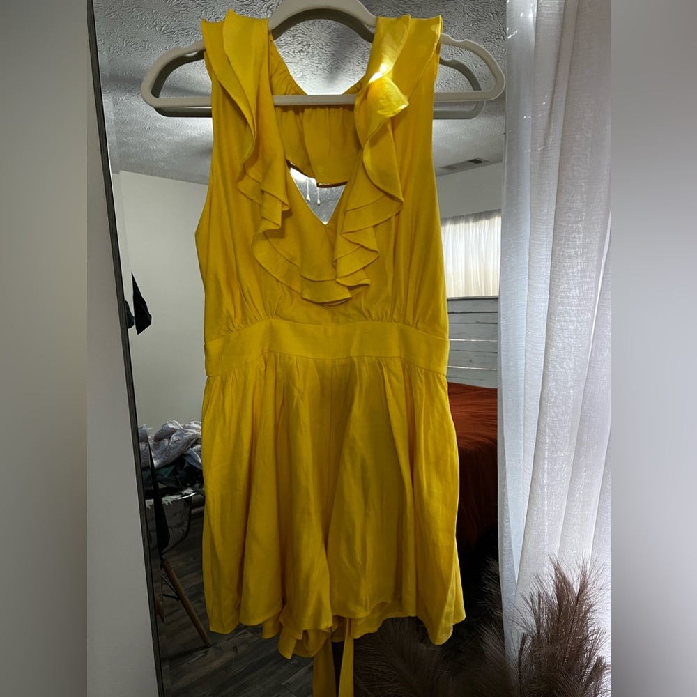 Yellow boutique romper. Size M. New with tags!